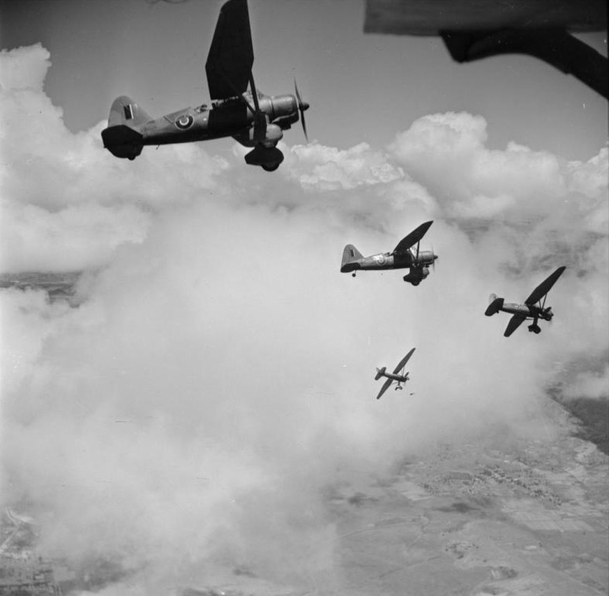 Royal Air Force Operations in Madagascar, 1942.
Four Westland Lysander Mark IIIAs of No. 1433 Flight RAF, based at Ivato, Madagascar, peeling off to port while in flight.