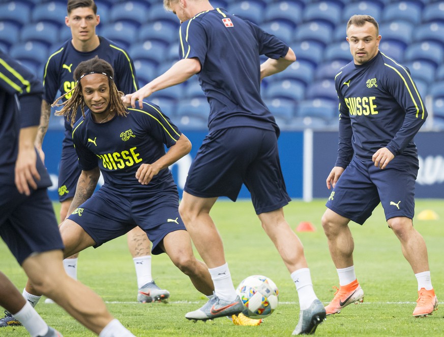 Switzerland&#039;s defender Kevin Mbabu, left, and Switzerland&#039;s midfielder Xherdan Shaqiri, right, in action during a training session at the Dragao stadium in Porto, Portugal, Tuesday, June 4,  ...