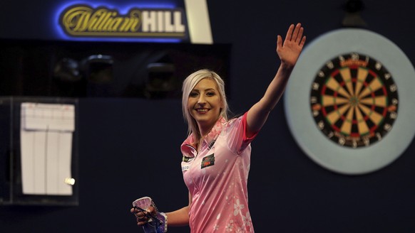 Fallon Sherrock celebrating after becoming the first women to win a game in the PDC Darts World Championship at Alexandra Palace, London, Tuesday Dec. 17, 2019. Sherrock become the first female player ...