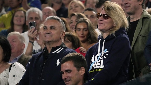 The parents of Novak Djokovic of Serbia, father Srdjan and mother Dijana react during his post match speech following his win over Andrey Rublev of Russia at the Australian Open tennis championship in ...