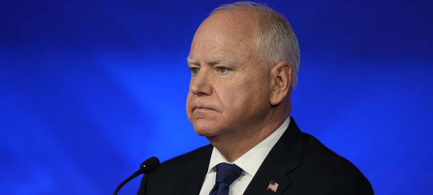 Democratic vice presidential nominee Minnesota Gov. Tim Walz listens during a vice presidential debate hosted by CBS News, with Republican vice presidential nominee Sen. JD Vance, R-Ohio, Tuesday, Oct ...