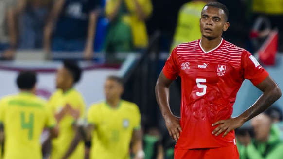 Switzerland&#039;s midfielder Remo Freuler and Switzerland&#039;s defender Manuel Akanji, react to the celebration of the Brazilian players on the cancelled goal from Brazil&#039;s forward Vinicius Ju ...