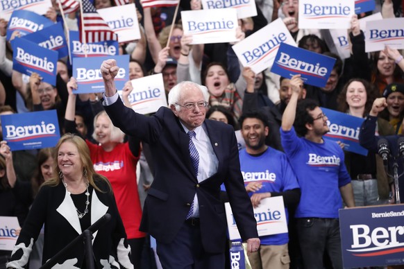 Democratic presidential candidate Sen. Bernie Sanders, I-Vt., with his wife Jane O&#039;Meara Sanders, arrives to speak to supporters at a primary night election rally in Manchester, N.H., Tuesday, Fe ...