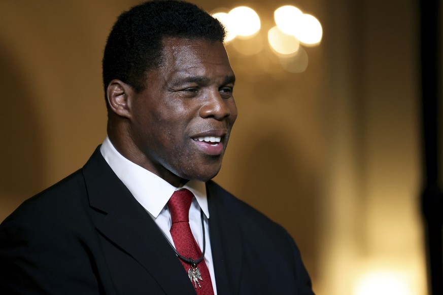 FILE - Herschel Walker speaks to members of the media after his Republican Primary win on Tuesday, May 24, 2022, at the Georgian Terrace Hotel in Atlanta. Walker will represent the Republican Party in ...