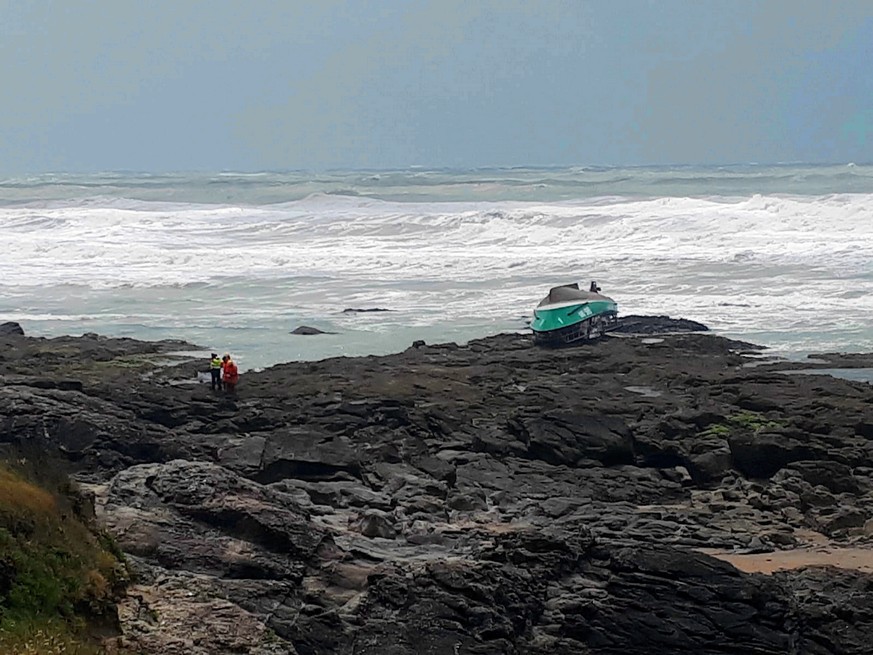 epa07633056 A general view on an overturned boat of a National Society of Sea Rescue rescue boat at the beach of Les Sables d&#039;Olonne, France, 07 June 2019. Three crew members of the rescue boat d ...