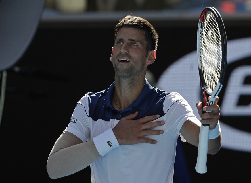 Serbia&#039;s Novak Djokovic celebrates after defeating United States&#039; Donald Young during their first round match at the Australian Open tennis championships in Melbourne, Australia, Tuesday, Ja ...