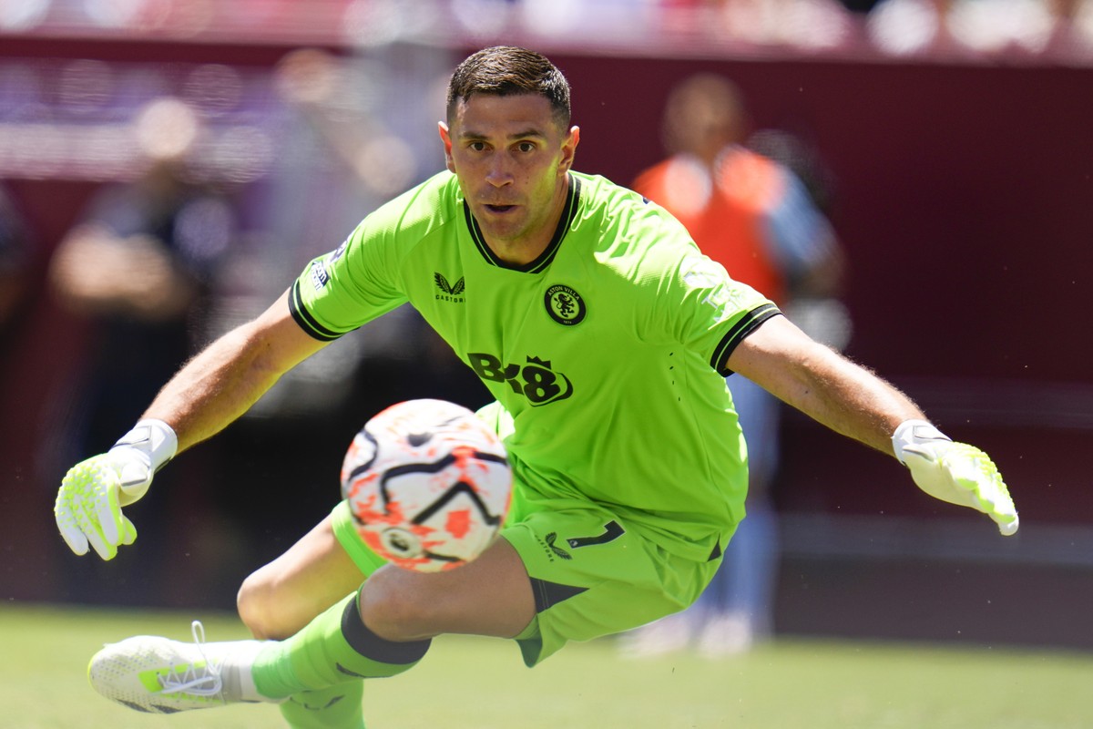 Aston Villa FC's goalkeeper Emiliano Martinez eyes a shot from Brentford FC during a Premier League Summer Series soccer match, Sunday, July 30, 2023, in Landover, Md. The teams tied 3-3. (AP Pho ...