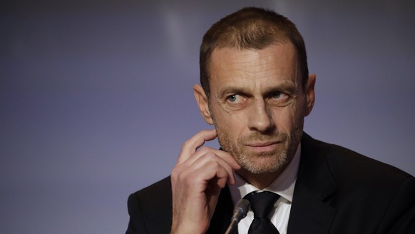 FILE - In this Thursday, Feb. 7, 2019 file photo, UEFA President Aleksander Ceferin listens to reporter&#039;s questions during a press conference at the end of the 43rd UEFA congress in Rome. Ceferin ...