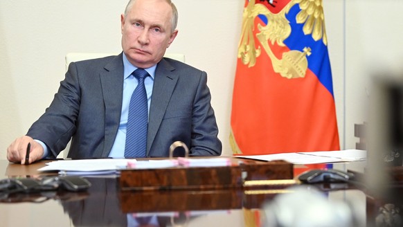 epa09419278 Russian President Vladimir Putin during a working video confrence meeting at Novo-Ogaryovo state residence, outside Moscow, Russia, 18 August 2021. EPA/ALEXEI NIKOLSKY/SPUTNIK /KREMLIN / P ...