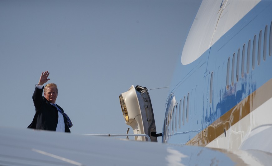 President Donald Trump boards Air Force One at Palm Beach International Airport, in West Palm Beach, Fla., Sunday, March 10, 2019, en route to Washington. (AP Photo/Carolyn Kaster)