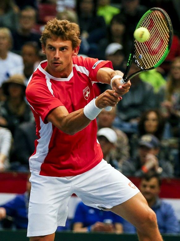 Switzerland&#039;s Henri Laaksonen returns the ball to United States&#039; Jack Sock and Steve Johnson during a Davis Cup tennis match, Saturday, Feb. 4, 2017, in Birmingham, Ala. (AP Photo/Butch Dill ...