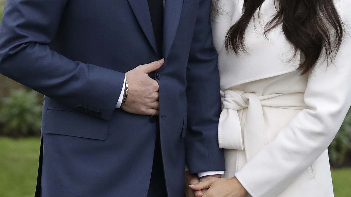 Britain's Prince Harry and his fiancee Meghan Markle pose for photographers during a photocall in the grounds of Kensington Palace in London, Monday Nov. 27, 2017. Britain's royal palace say ...