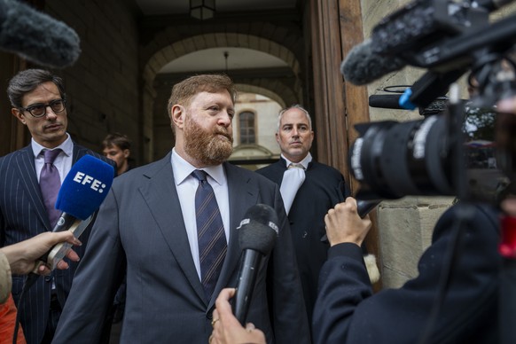 epa11600538 Former head of Guatemala&#039;s national police Erwin Sperisen (C) with his lawyers Giorgio Campa (L) and Florian Baier (R) talk to the media at the courthouse after the verdict in his fou ...