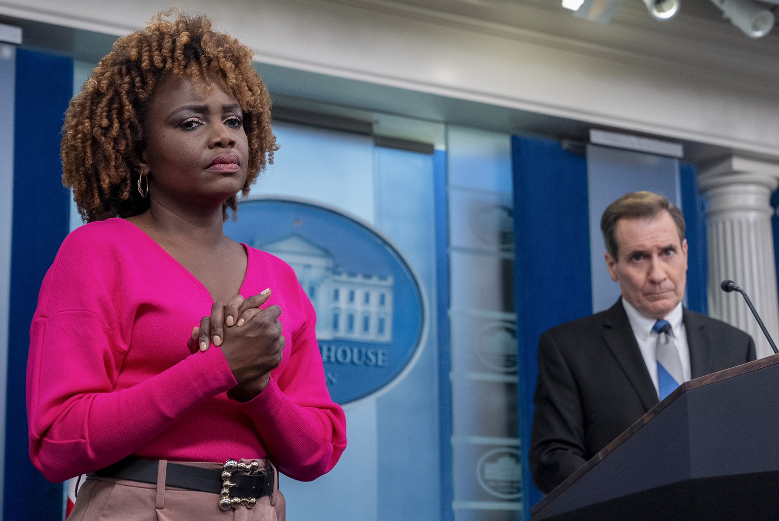White House national security communications adviser John Kirby, accompanied by White House press secretary Karine Jean-Pierre, listens to a question from a reporter during a press briefing at the Whi ...