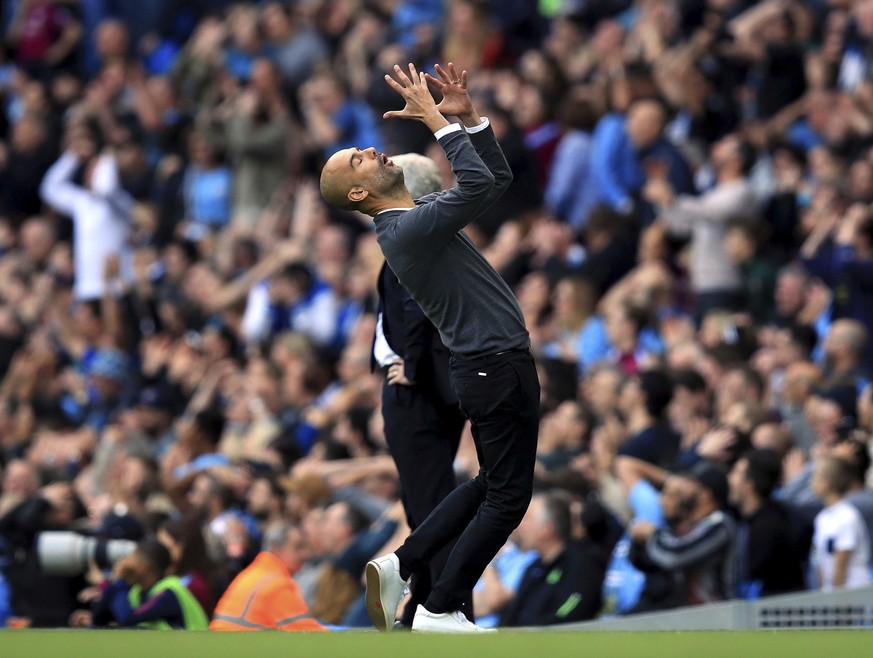 Manchester City manager Pep Guardiola gestures during the English Premier League soccer match between Manchester City and Stoke City at Etihad Stadium, Manchester, England, Saturday, Oct. 14, 2017. (M ...