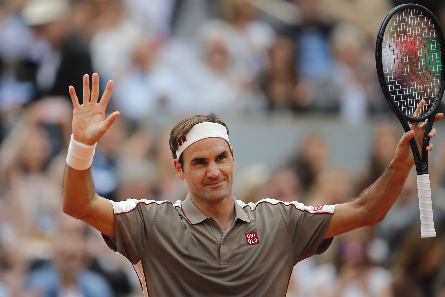 Switzerland&#039;s Roger Federer celebrates winning against Italy&#039;s Lorenzo Sonego during their first round match of the French Open tennis tournament at the Roland Garros stadium in Paris, Sunda ...