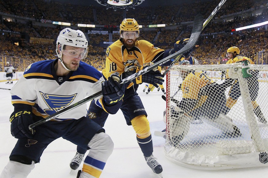 St. Louis Blues left wing Vladimir Sobotka, left, pursues the puck against Nashville Predators right wing James Neal in the second period during Game 3 of a second-round NHL hockey playoff series Sund ...