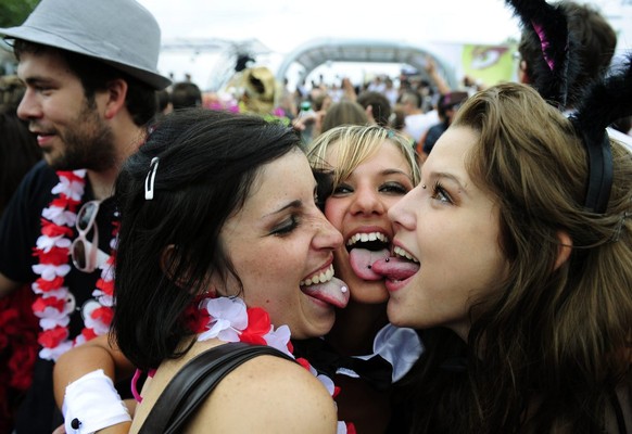 Fancyfully dressed participants of the annual Street Parade celebrate and dance in the city center of Zurich, Switzerland, on Saturday, August 14, 2010. Hundreds of thousands of ravers participate in  ...