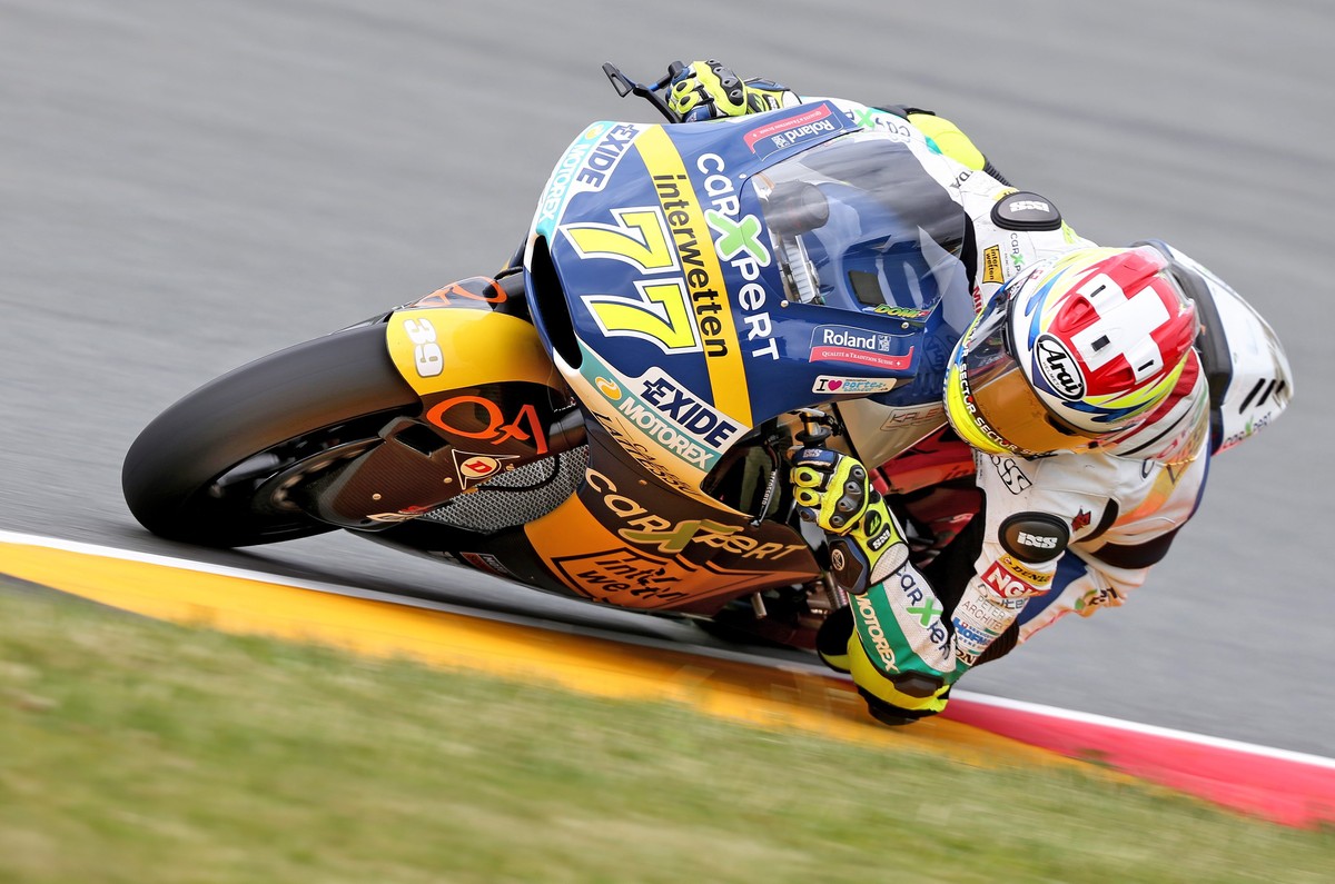 epa05426560 Swiss Moto2 driver Dominique Aegerter from the CarXpert Interwetten Team takes a bend during the second free training at the Motorcyle World Championship Grand Prix Germany on the Sachsenr ...