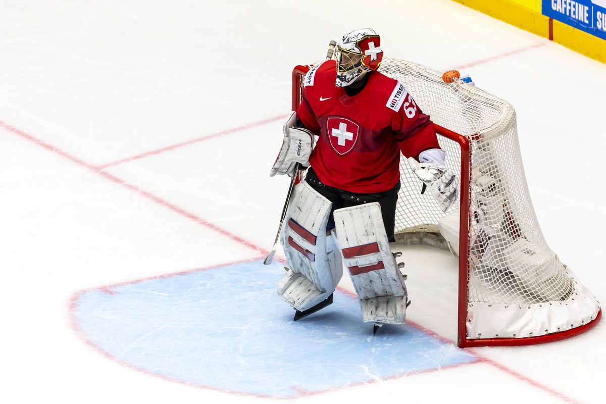 Switzerland's goaltender Leonardo Genoni looks his teammates, during the IIHF 2025 World Championship preliminary round group B game between Switzerland and Germany, at the Jyske Bank Boxen, in H ...