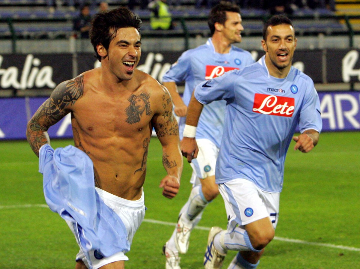 Napoli's Ezequiel Lavezzi, of Argentina, left, celebrates after scoring with teammate Fabio Quagliarella, right, during a Serie A soccer match between Cagliari and Napoli, in Cagliari, Italy, Sat ...