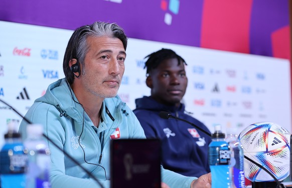 epa10349464 Switzerland&#039;s head coach Murat Yakin (L) and his forward Breel Embolo attend a press conference at Qatar National Convention Center (QNCC) in Doha, Qatar, 05 December 2022. Switzerlan ...