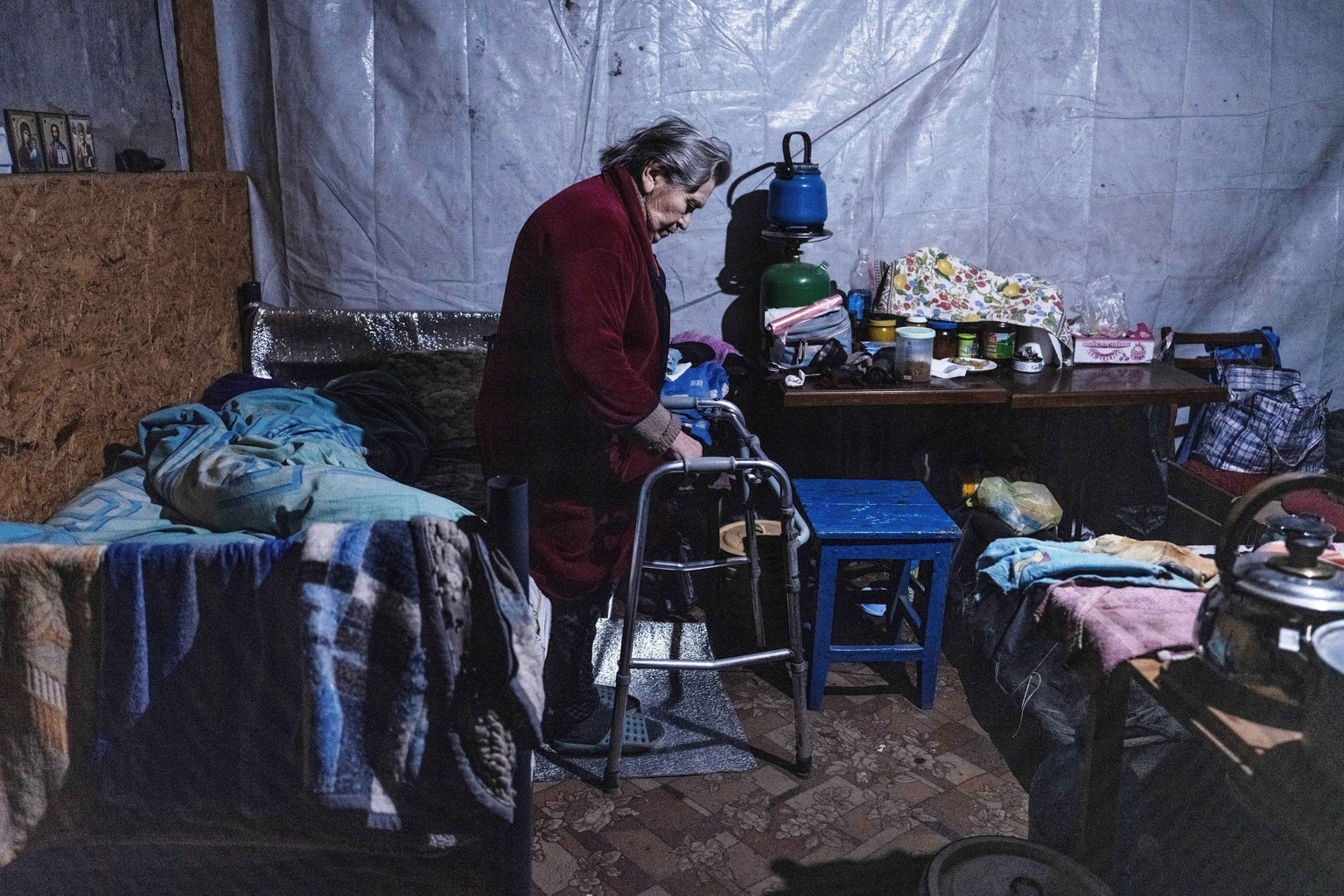 In this photo provided by Ukraine&#039;s 93rd Kholodnyi Yar Separate Mechanized Brigade press service, a woman takes shelter in the basement of a multi-apartment building in Pokrovsk, the site of heav ...