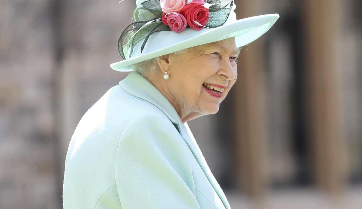 FILE - In this July 17, 2020 file photo, Britain's Queen Elizabeth smiles after awarding Captain Sir Thomas Moore his knighthood during a ceremony at Windsor Castle in Windsor, England. The forme ...