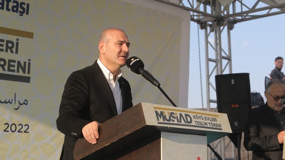 epa10304300 Turkish Minister of Interior Suleyman Soylu (C) speaks during the opening ceremony of a new housing project established by Turkey in Idlib, Syria, 13 November 2022. Turkish Minister of Int ...