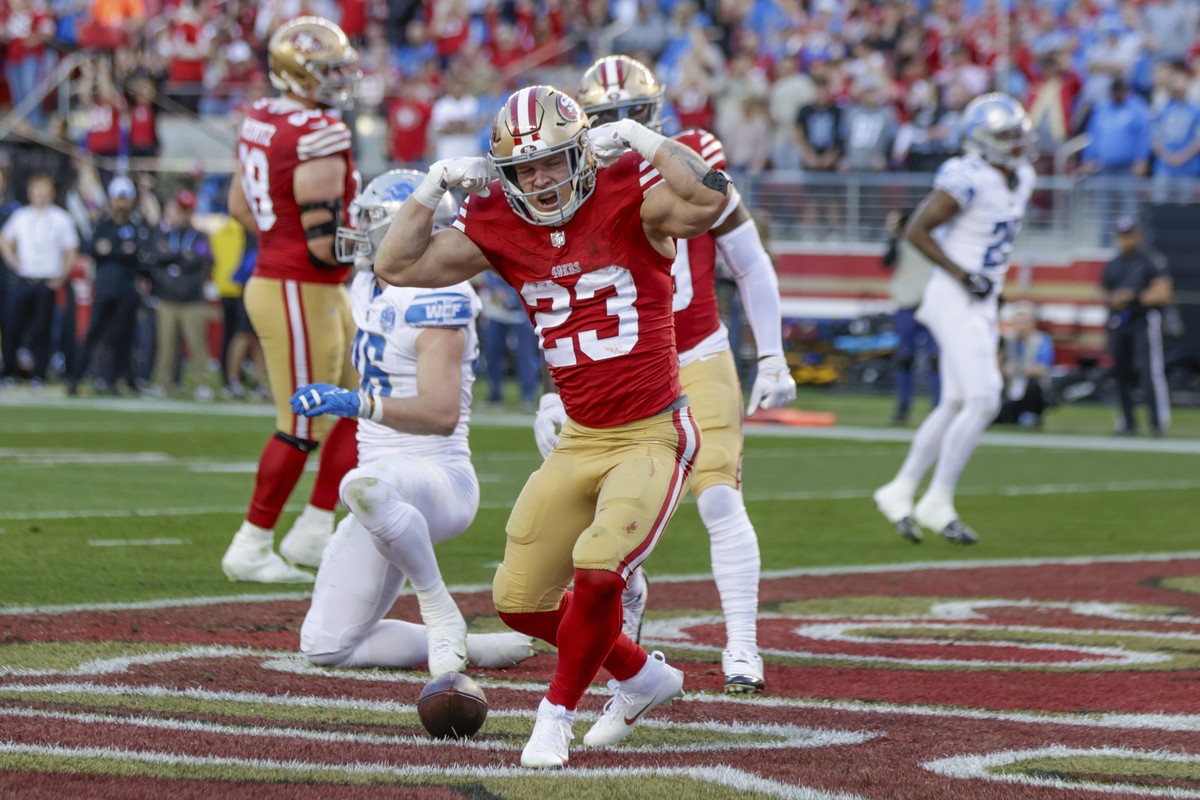 San Francisco 49ers' running back Christian McCaffrey (23) reacts after scoring a touchdown against the Detroit Lions in the second quarter of the NFC Championship NFL football game in Santa Clar ...