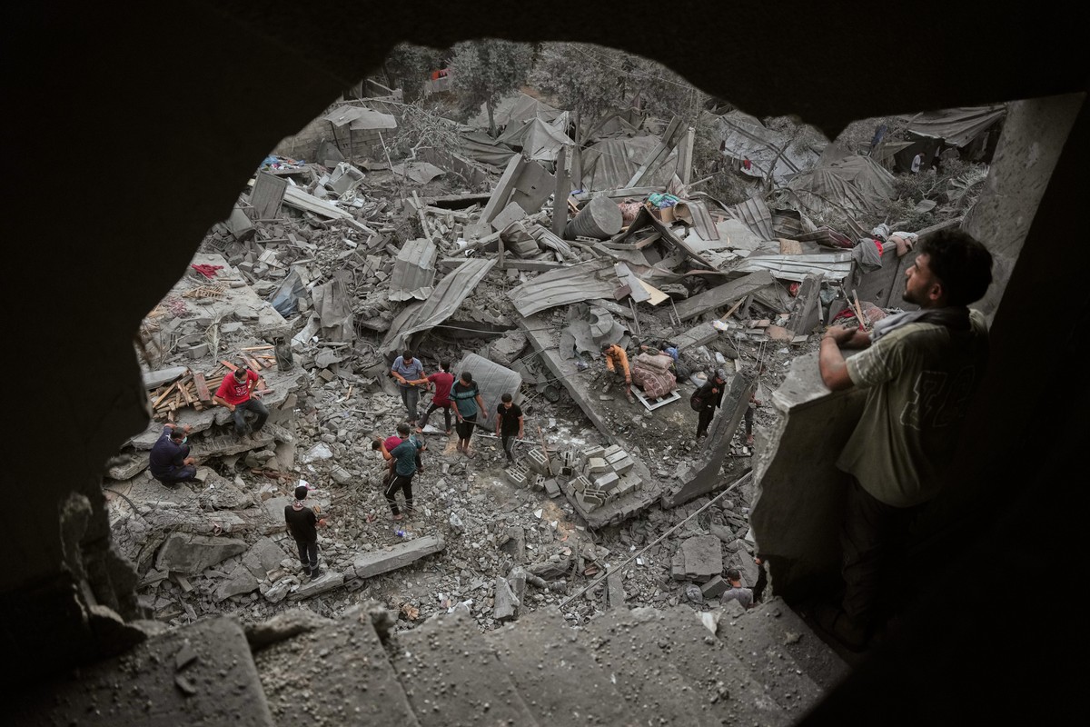 Palestinians inspect a building destroyed in an Israeli airstrike late Saturday in Zawaida, central Gaza Strip, Sunday, Oct. 11, 2026. (AP Photo/Abdel Kareem Hana)
APTOPIX Israel Palestinians Gaza