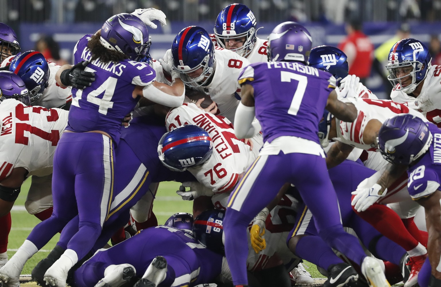 New York Giants&#039; Daniel Jones runs for a first down during the second half of an NFL wild card football game against the Minnesota Vikings Sunday, Jan. 15, 2023, in Minneapolis. (AP Photo/Bruce K ...