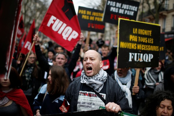 People shout slogans during demonstration against police brutality in Paris, France, March 19, 2017. REUTERS/Gonzalo Fuentes