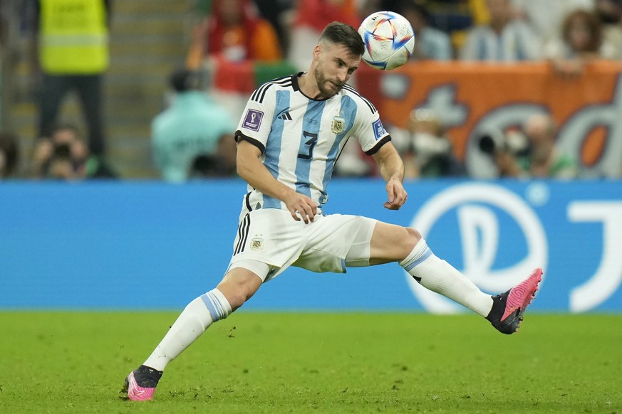 Argentina&#039;s Nicolas Tagliafico controls the ball during the World Cup quarterfinal soccer match between the Netherlands and Argentina, at the Lusail Stadium in Lusail, Qatar, Friday, Dec. 9, 2022 ...