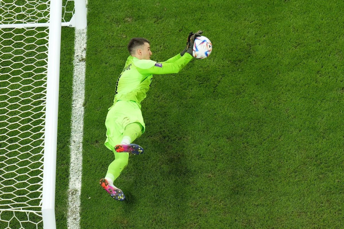 Croatia's goalkeeper Dominik Livakovic saves a shot during a penalty shootout during the World Cup quarterfinal soccer match between Croatia and Brazil, at the Education City Stadium in Al Rayyan ...
