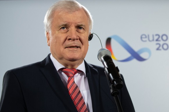 epa08817579 German Minister of Interior, Construction and Homeland Horst Seehofer speaks to the media prior to a virtual conference of EU Affairs Ministers in Berlin, Germany, 13 November 2020. The co ...
