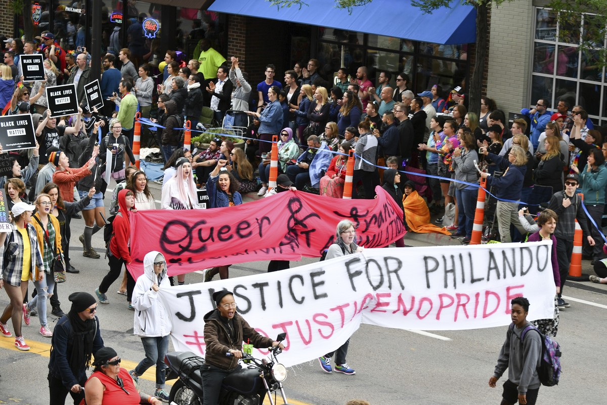 Black Lives Matter protesters block the Twin Cities Pride Parade along Hennepin Ave at the start of the parade in Minneapolis, Sunday, June 25, 2017. Sunday's parade was disrupted over the police ...