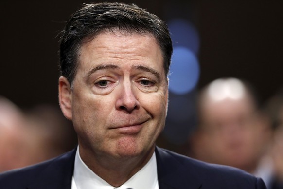 Former FBI Director James Comey reacts during a Senate Intelligence Committee hearing on Capitol Hill, Thursday, June 8, 2017, in Washington. (AP Photo/Alex Brandon)