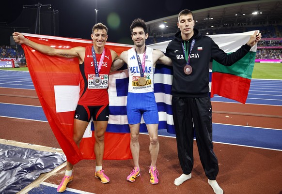 epa13162365 Gold medalist Miltiadis Tentoglou of Greece (C), silver medalist Simon Ehammer of Switzerland (L) and bronze medalist Bozhidar Saraboyukov of Bulgaria celebrate after the Men's Long J ...