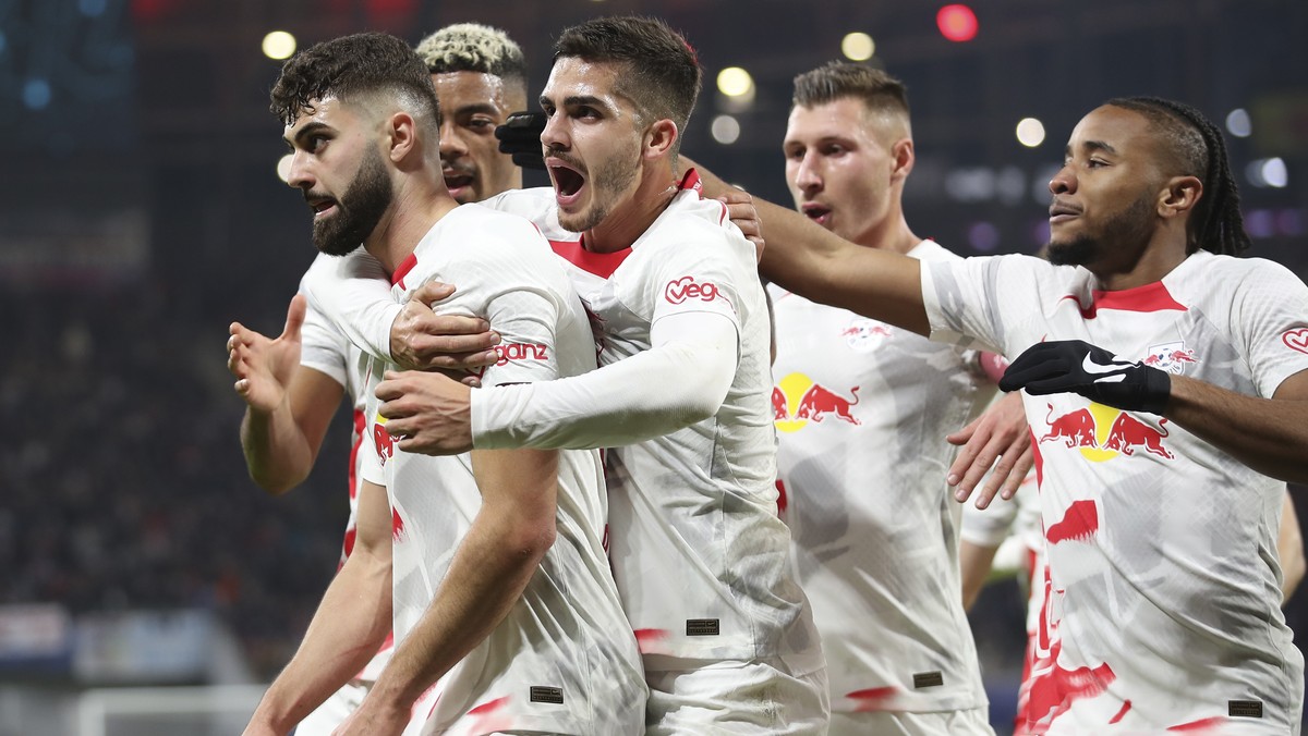 RB Leipzig players celebrate after Leipzig's Josko Gvardiol, left, scored his side's opening goal during the UEFA Champions League round of sixteen first leg soccer match between RB Leipzig  ...