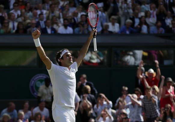 Roger Federer of Switzerland celebrates at match point after beating Marin Cilic of Croatia in their men&#039;s singles match on day ten of the Wimbledon Tennis Championships in London, Wednesday, Jul ...