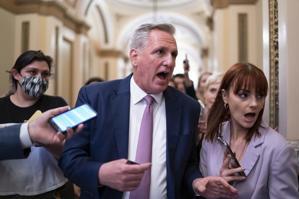 FILE - House Minority Leader Kevin McCarthy, R-Calif., heads to his office surrounded by reporters after House investigators issued a subpoena to McCarthy and four other Republican lawmakers as part o ...