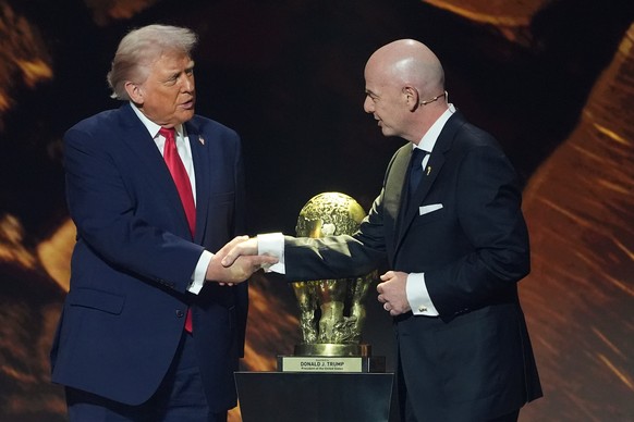 FILE - President Donald Trump shakes hands with FIFA President Gianni Infantino as he presented with the inaugural FIFA Peace Prize during the 2026 FIFA World Cup draw at the Kennedy Center, Dec. 5, 2 ...