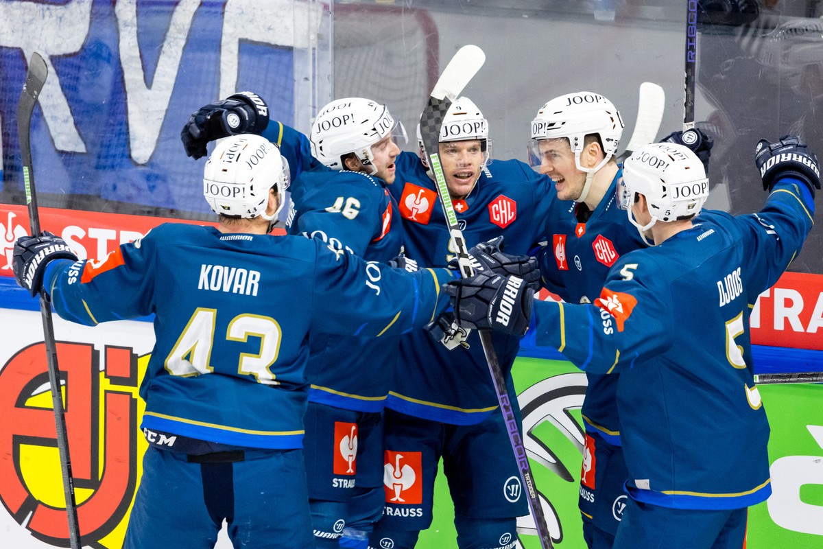 Jan Kovar, Lino Martschini, Brian O'Neill, Dario Simion and Christian Djoos of EV Zug, from left, celebrate victory after the Champions Hockey League playoff quarterfinal second leg game between  ...