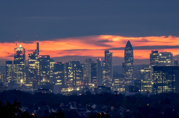 The buildings of the banking district are pictured before sunrise in Frankfurt, Germany, Thursday, Oct. 26, 2023. The ECB&#039;s governing council will meet in Athens on Thursday. (AP Photo/Michael Pr ...