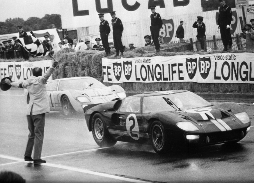 Le Mans Official final placings in the 24-hour sports car race were in No 2 Ford , Bruce McLaren and Chris Amon of New Zealand , shown here crossing the finishing line . Roy Lunn , British designer of ...