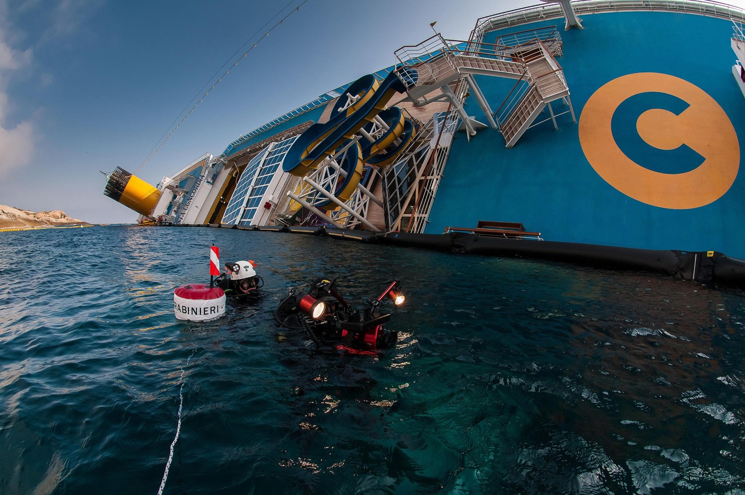 epa04297017 A picture released by the Italian Carabinieri on 03 July 2014 shows Carabinieri divers inspecting the Costa Concordia cruise ship, at Giglio Island, Italy, in 2012. The Costa Concordia hit ...