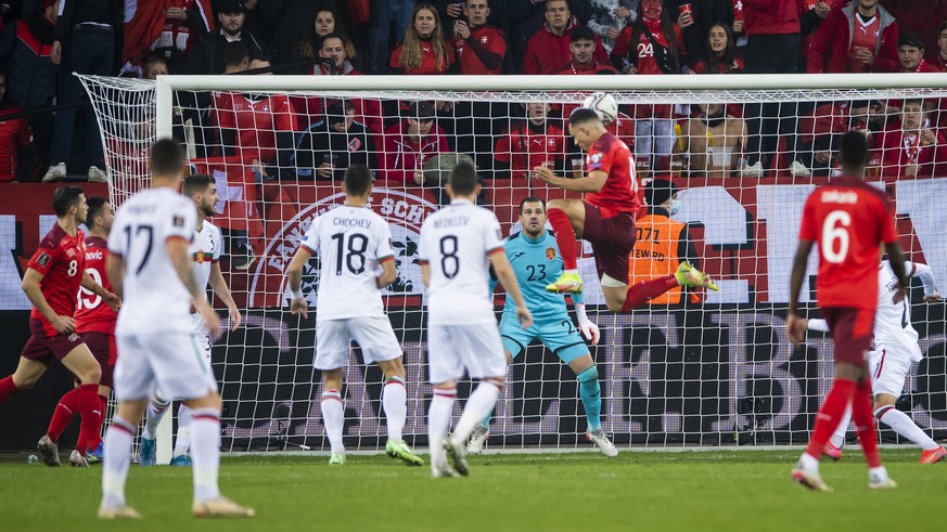 Switzerland's forward Noah Okafor, center, scores a goal against Bulgaria's goalkeeper Ivan Karadzhov during the 2022 FIFA World Cup European Qualifying Group C match between Switzerland and ...