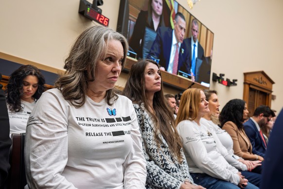 Survivors of convicted sex trafficker Jeffrey Epstein listen to a statement by Rep. Darrell Issa, R-Calif., on TV monitor, as Attorney General Pam Bondi testifies before the House Judiciary Committee  ...