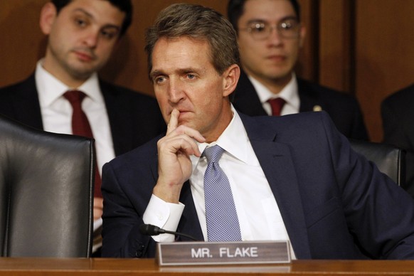 FILE - In this Jan. 28, 2015 file photo, Sen. Jeff Flake, R-Ariz. listens on Capitol Hill in Washington. Two years ago, Sen. Bob Corker wondered aloud whether the standstill Senate was worth a grown m ...